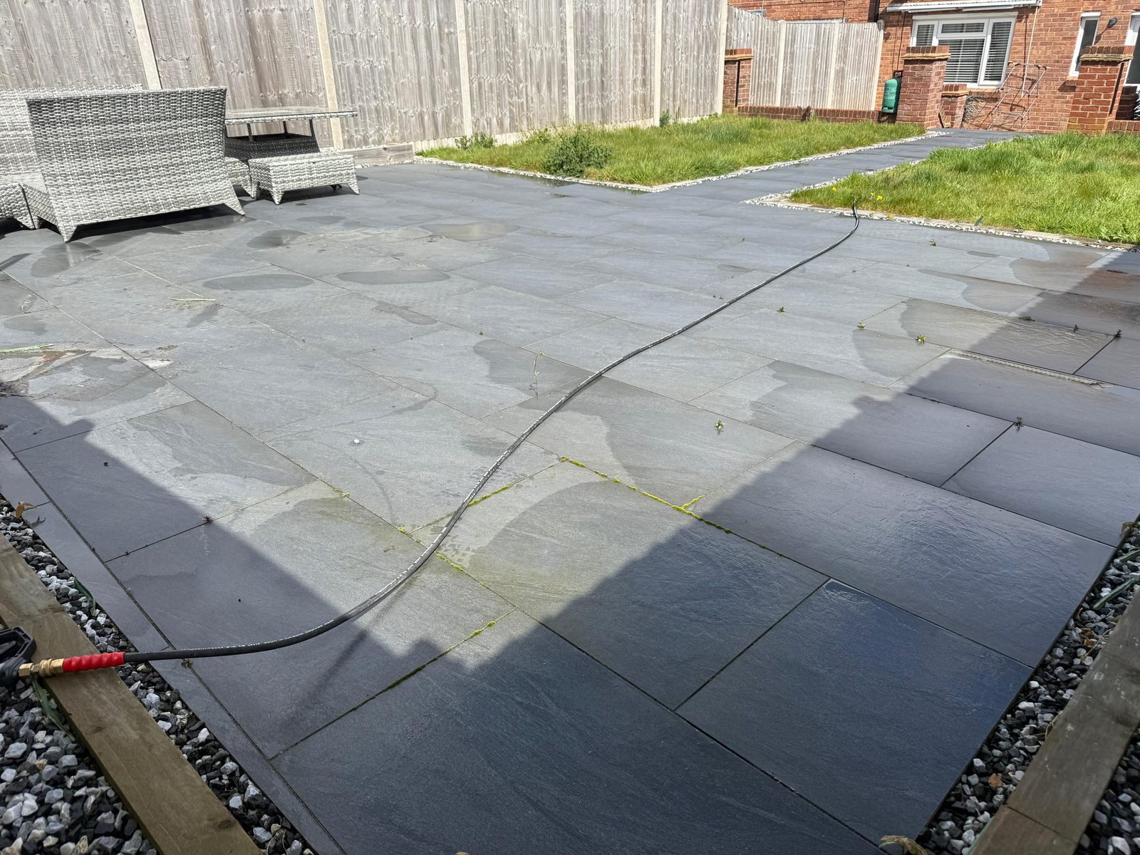 Tired stone patio before cleaning